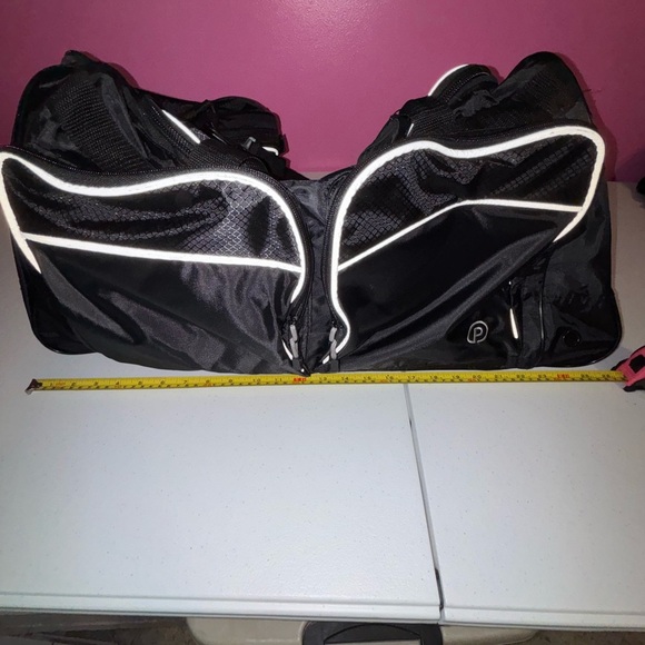 Black Duffel Bag with White Accents and Modern Design - Picture 6 of 13